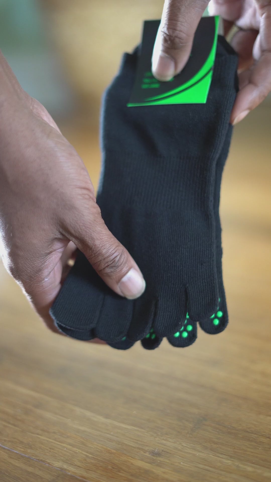 NeuroSox Five Toe Grip Sock shown from behind, displaying ergonomic toe spread and anti-slip sole during balance stance
